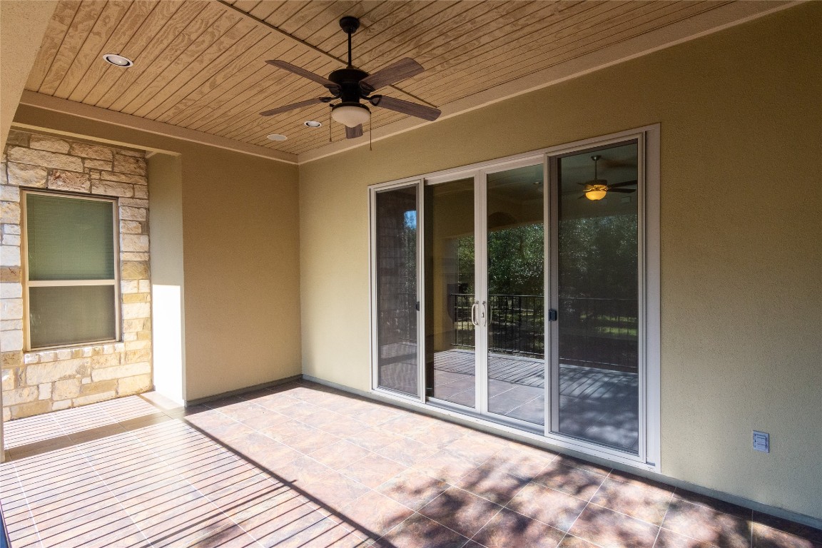 316 Chadwick Drive Georgetown, TX 78628 - Photo 26 of 39 a view of a hall with wooden floor and a ceiling fan
