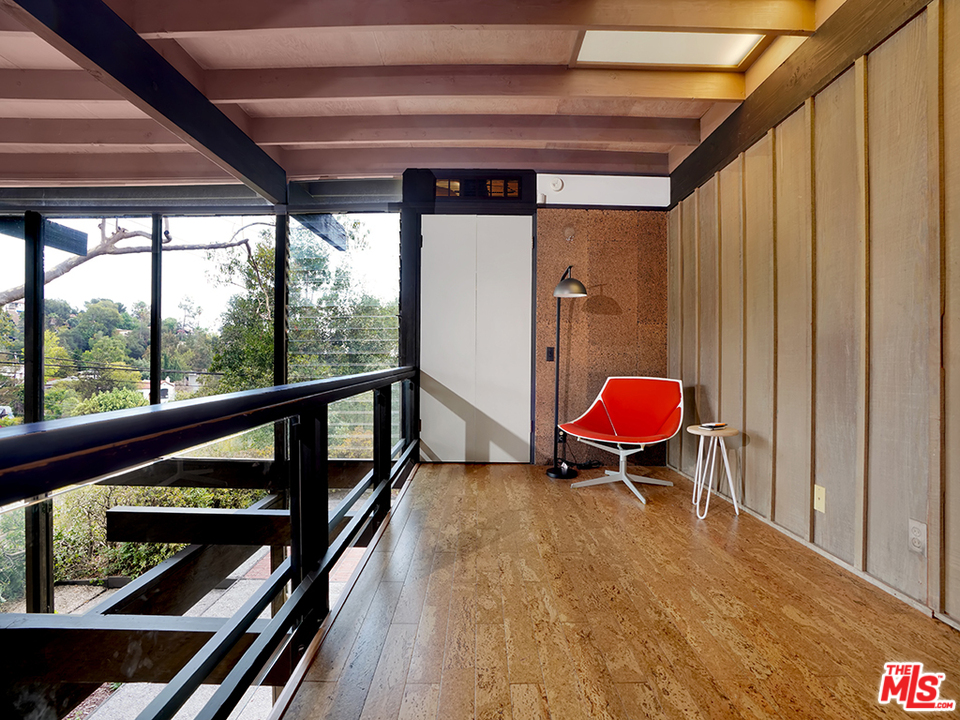 1617 Pleasant Way Pasadena, CA 91105 - Photo 11 of 38 a chair and table in a room next to a window