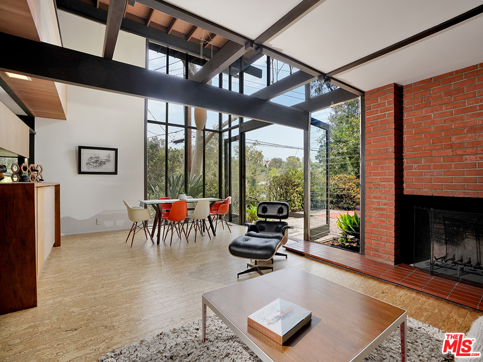 1617 Pleasant Way Pasadena, CA 91105 - Photo 23 of 38 a living room with furniture a floor to ceiling window and a flat screen tv