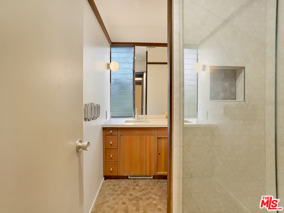 1617 Pleasant Way Pasadena, CA 91105 - Photo 30 of 38 a bathroom with a granite countertop sink and a mirror