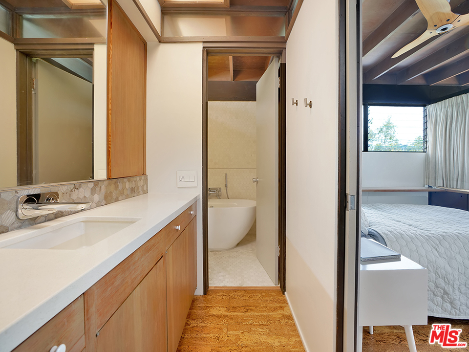 1617 Pleasant Way Pasadena, CA 91105 - Photo 6 of 38 a bathroom with a granite countertop sink and a mirror