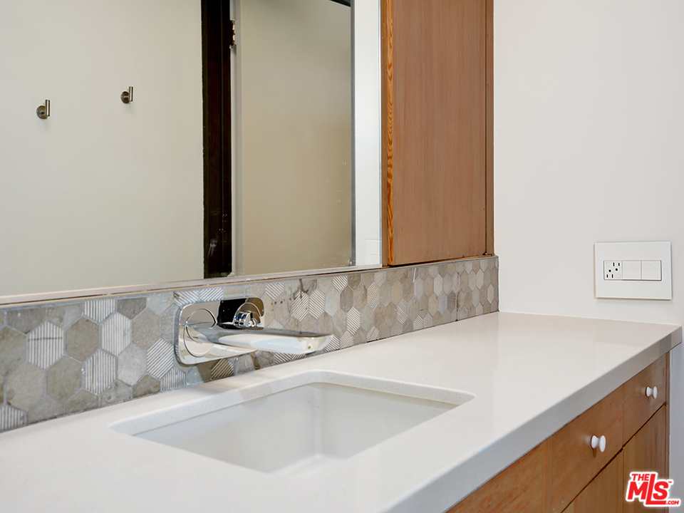 1617 Pleasant Way Pasadena, CA 91105 - Photo 7 of 38 a bathroom with a sink and a mirror