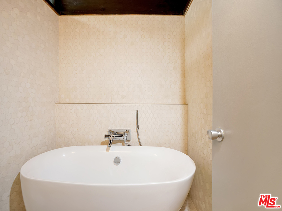 1617 Pleasant Way Pasadena, CA 91105 - Photo 8 of 38 a white bath tub sitting in a bathroom