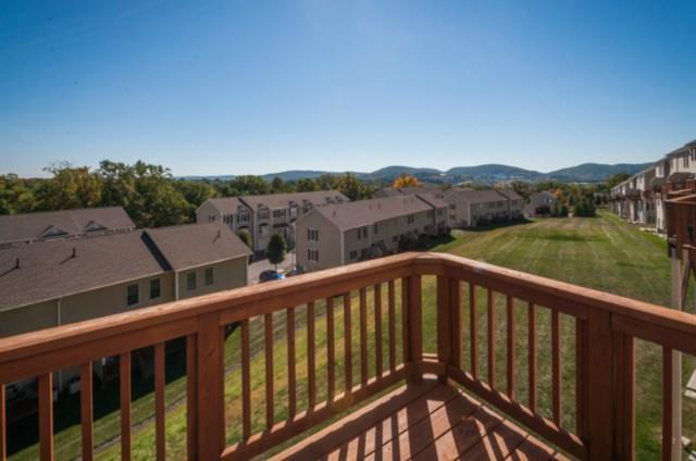 a balcony with an outdoor space