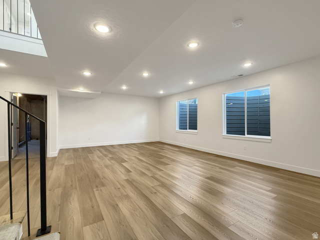916 Rocky Mountain Way Elk Ridge, UT 84651 - Photo 44 of 54 Unfurnished room with light wood-style flooring and recessed lighting
