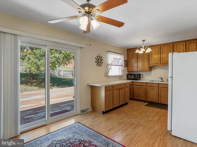 a view of an entryway with wooden floor