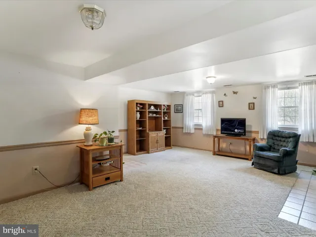 a view of a livingroom with furniture and closet