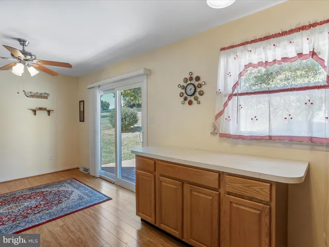 a white refrigerator freezer and a stove sitting inside of a kitchen