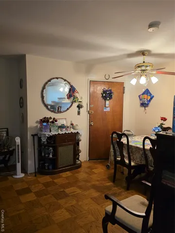 a room with furniture and gym equipment