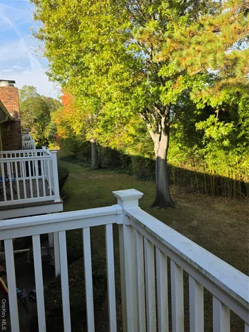 a view of a wooden deck and lake