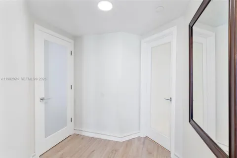 a spacious bathroom with a bathtub sink mirror and toilet