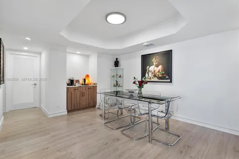 a view of a workspace with furniture and a kitchen