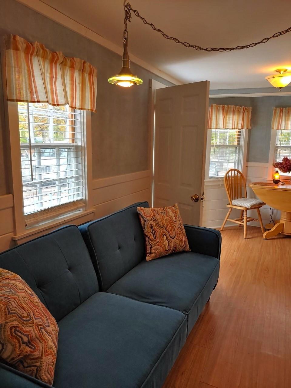 633 Route 6, Unit 3 Wellfleet, MA 02667 - Photo 5 of 9 a living room with furniture and a large window