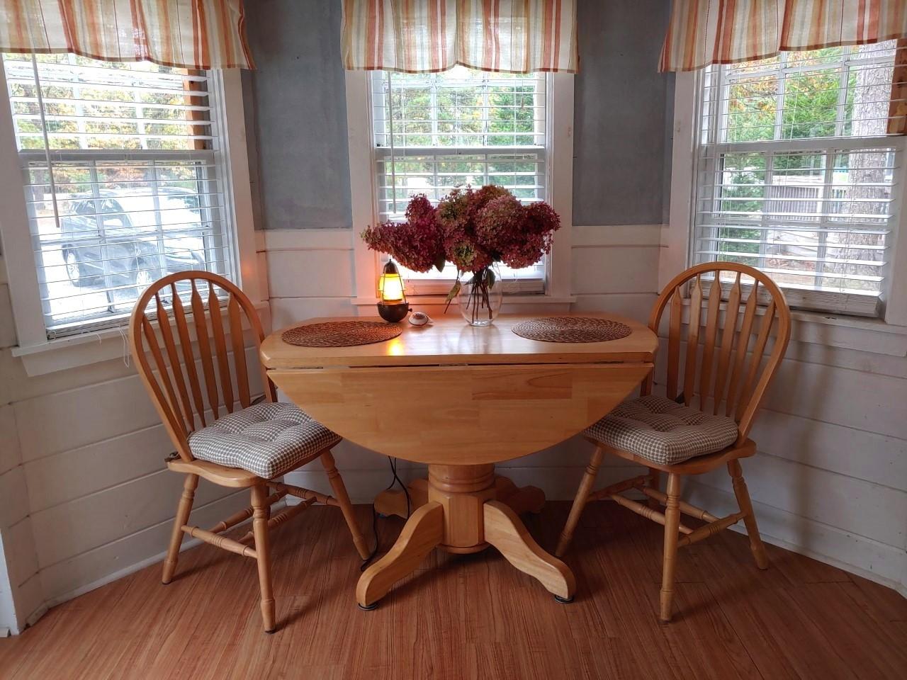633 Route 6, Unit 3 Wellfleet, MA 02667 - Photo 6 of 9 a view of a dining room with furniture window and outside view