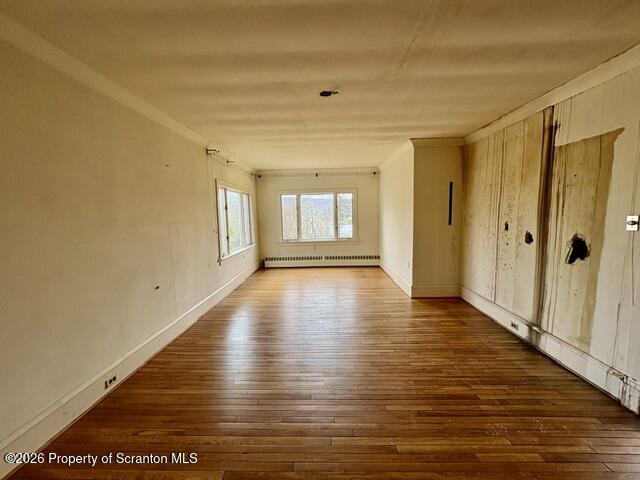 706 Delaware Street Forest City, PA 18421 - Photo 6 of 33 a view of an empty room with wooden floor and a window