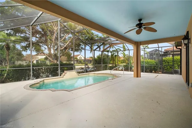 a view of a swimming pool with a yard