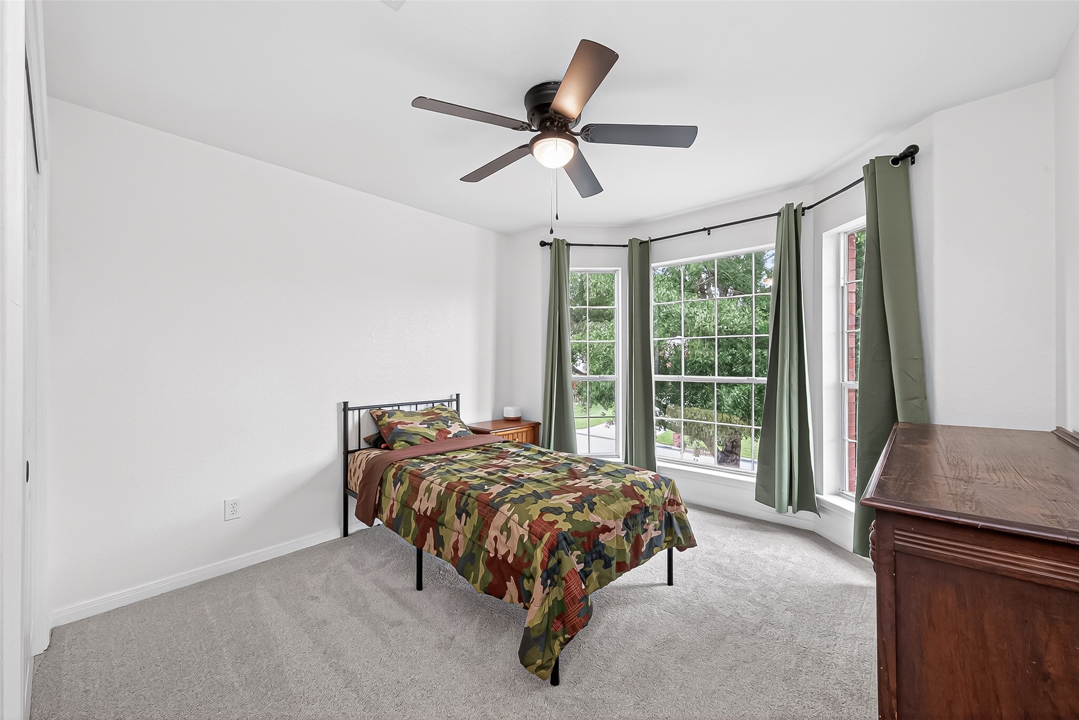 7411 Stonesfield Place Spring, TX 77389 - Photo 24 of 37 2nd Floor - Bedroom 3. High efficiency ceiling fans installed for maximum airflow and lower energy consumption.