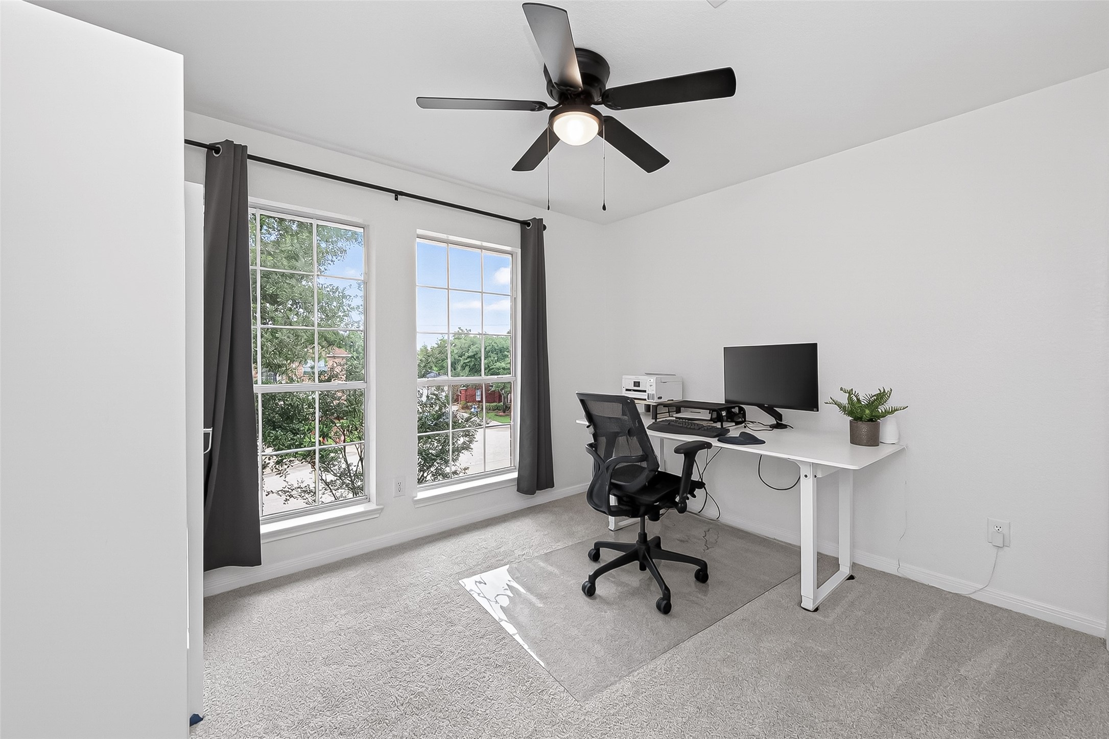 7411 Stonesfield Place Spring, TX 77389 - Photo 25 of 37 2nd Floor - Bedroom 4. High efficiency ceiling fans installed for maximum airflow and lower energy consumption.