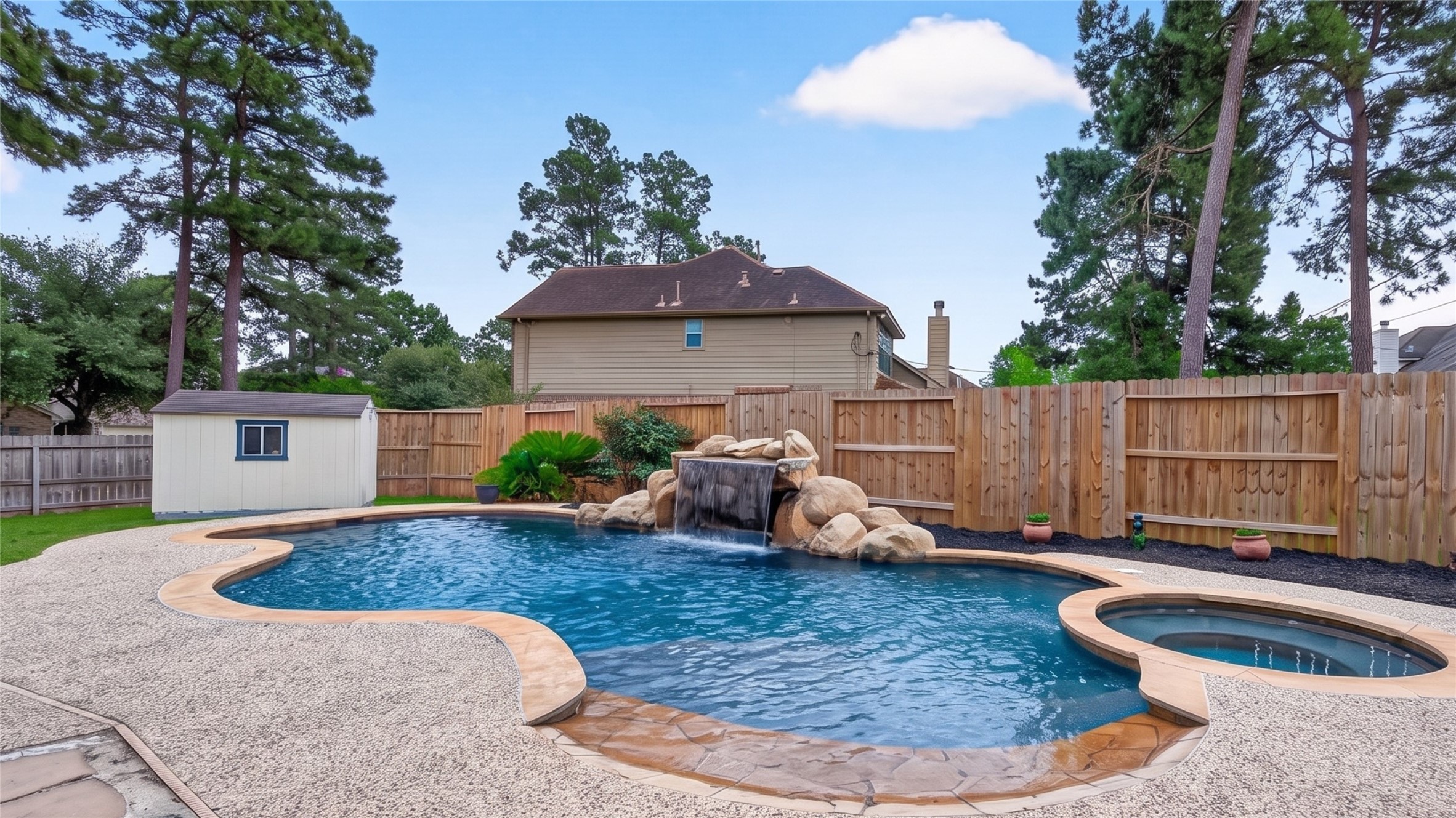 7411 Stonesfield Place Spring, TX 77389 - Photo 30 of 37 Pool - Resort pool with a hot tub.