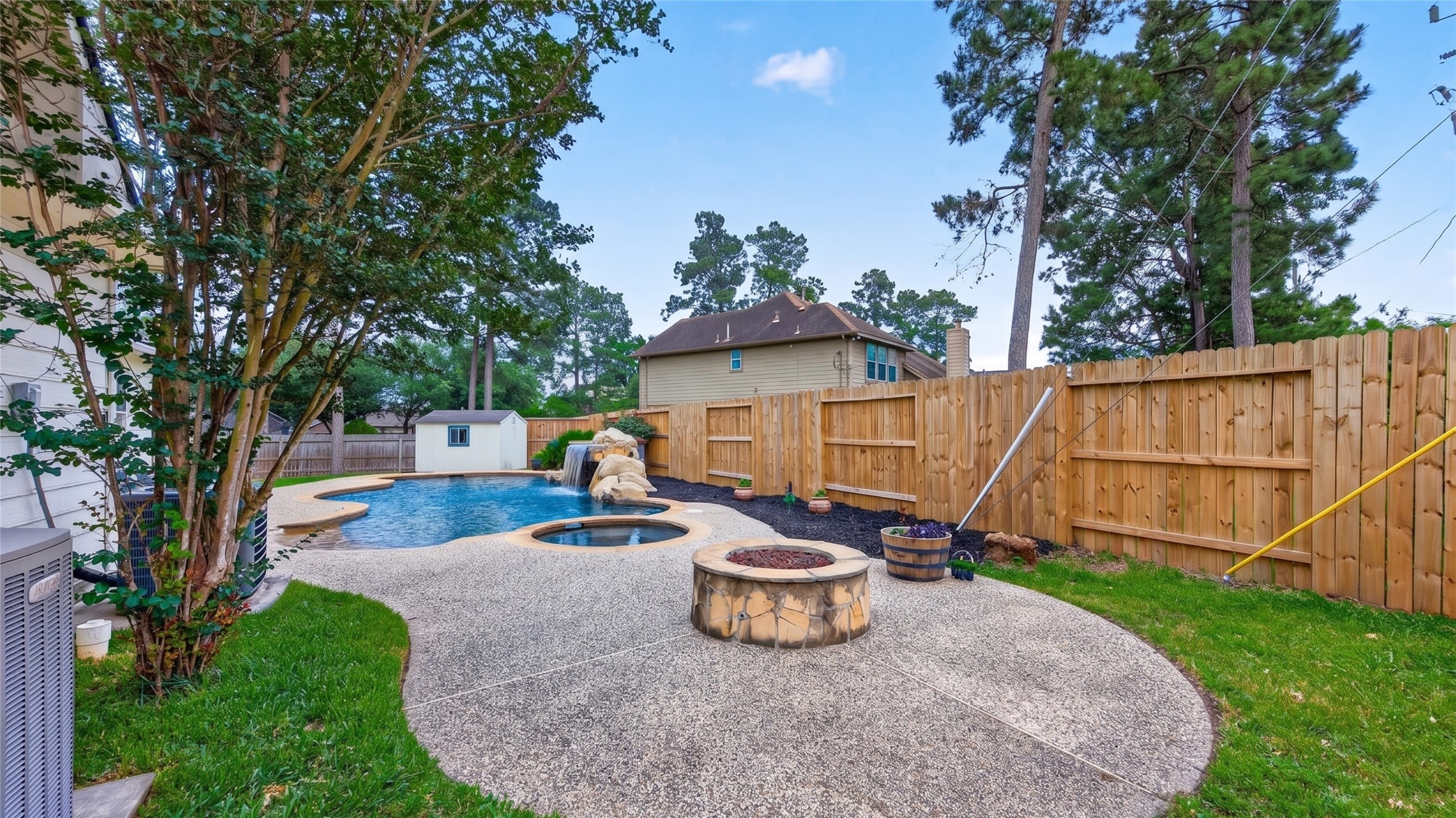 7411 Stonesfield Place Spring, TX 77389 - Photo 33 of 37 Pool - Resort pool with a hot tub.