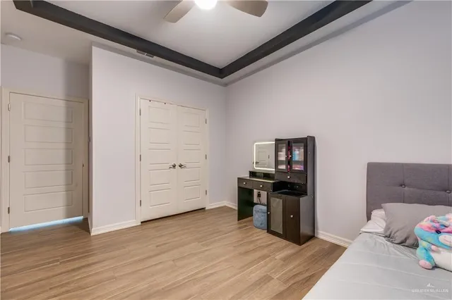 a kitchen with a refrigerator and a stove top oven