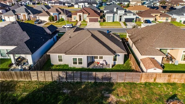 a view of a house with a garden and plants