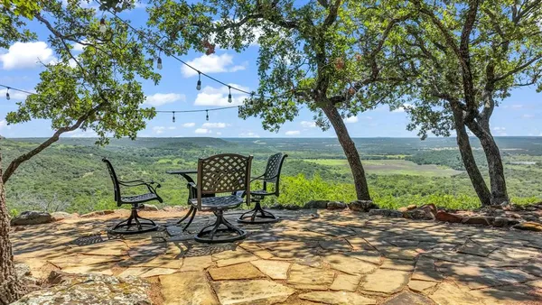 a view of a couches in backyard of house