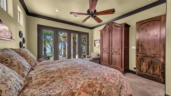 a bedroom with a large bed and a large window