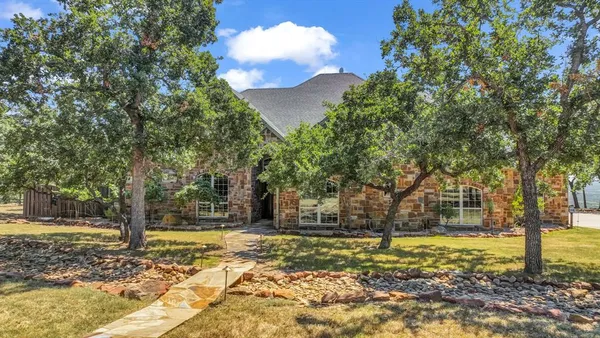 a house with trees in the background