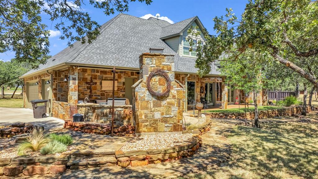 740 Post Oak Road Gordon, TX 76453 - Photo 31 of 40 a view of a house with a tree in the background