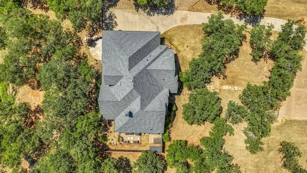 an aerial view of a house with swimming pool