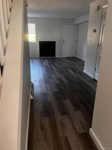 a view of a livingroom with wooden floor