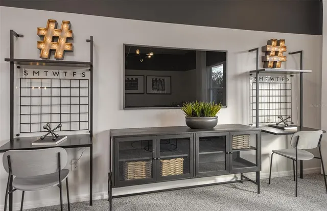 a dining room with furniture and window