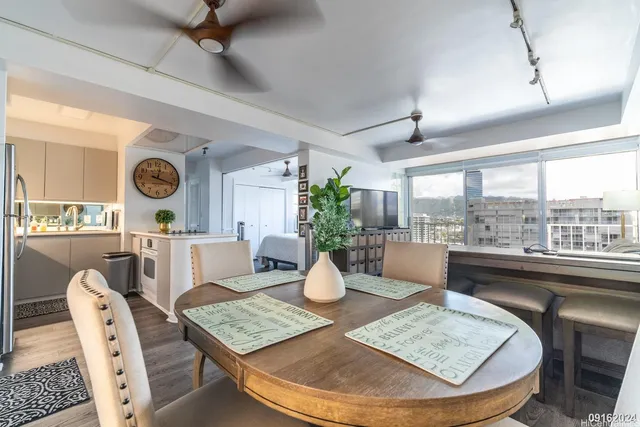 a living room with dining table and chairs