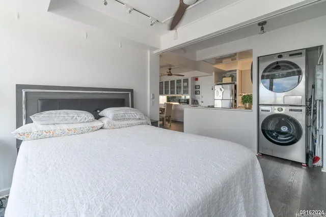 a bedroom with bed and a fireplace