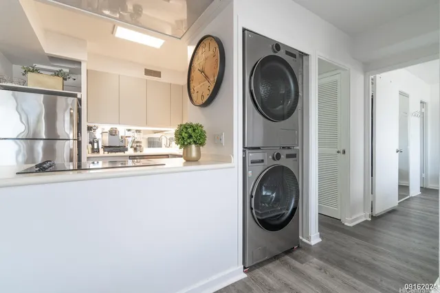 a utility room with sink dryer and washer