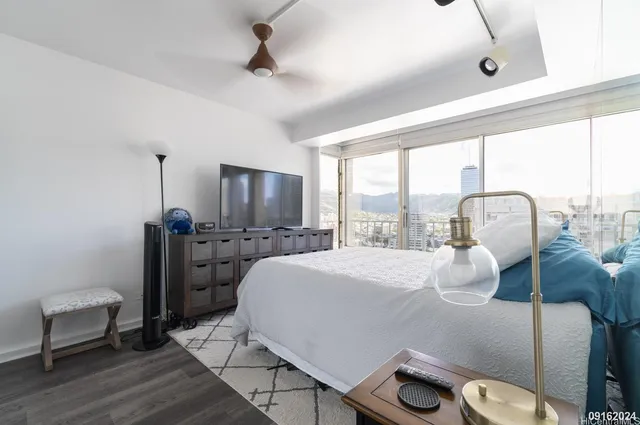 a bedroom with furniture and a window