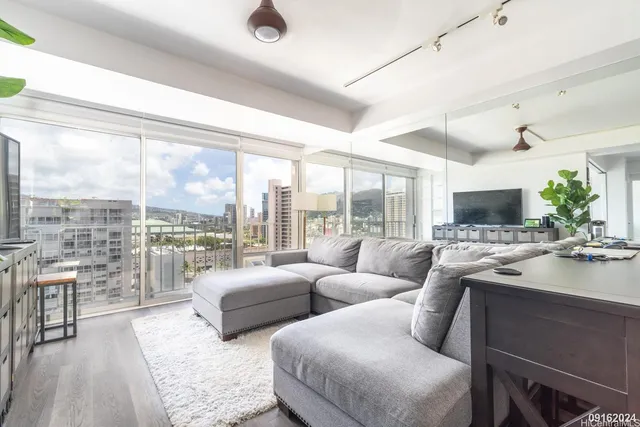 a living room with furniture and a large window