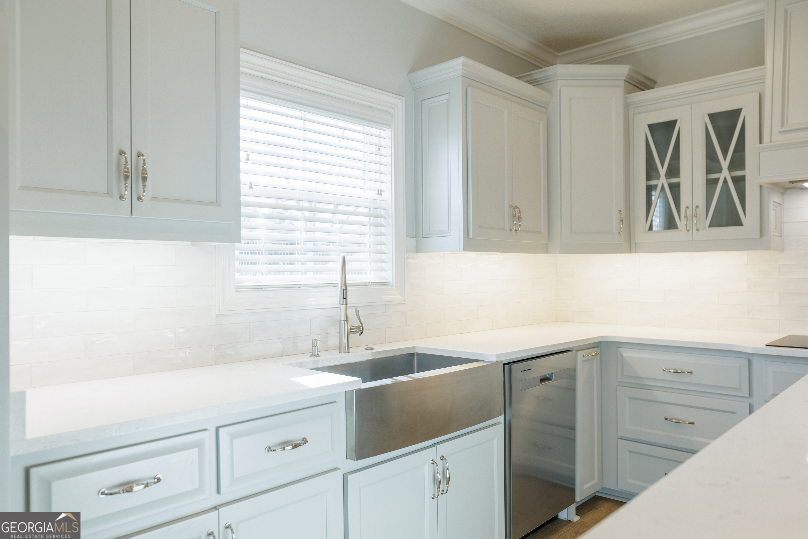 3001 Houser Way Hahira, GA 31632 - Photo 11 of 57 a kitchen with a sink and cabinets