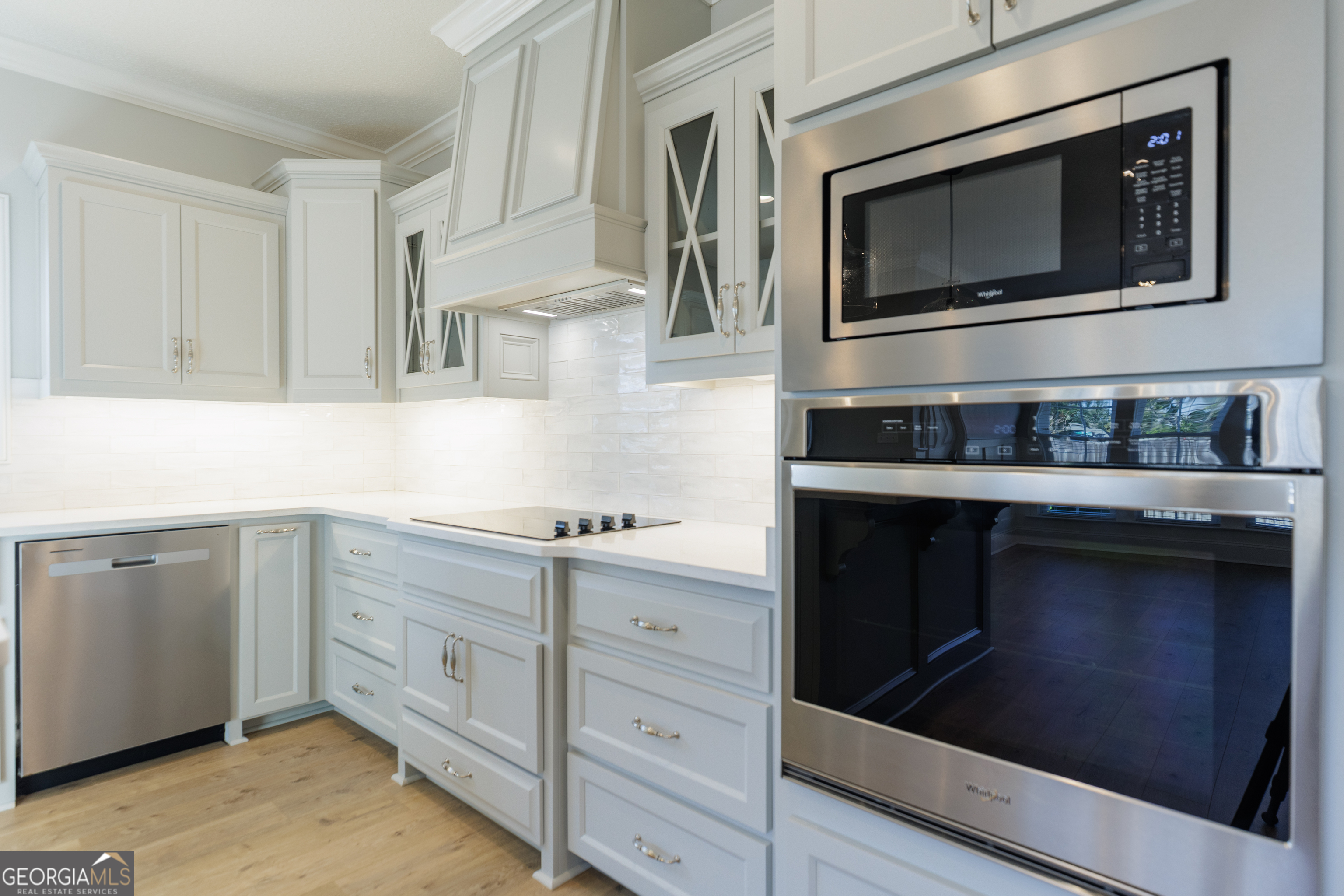 3001 Houser Way Hahira, GA 31632 - Photo 13 of 57 a kitchen with stainless steel appliances granite countertop a stove and a microwave