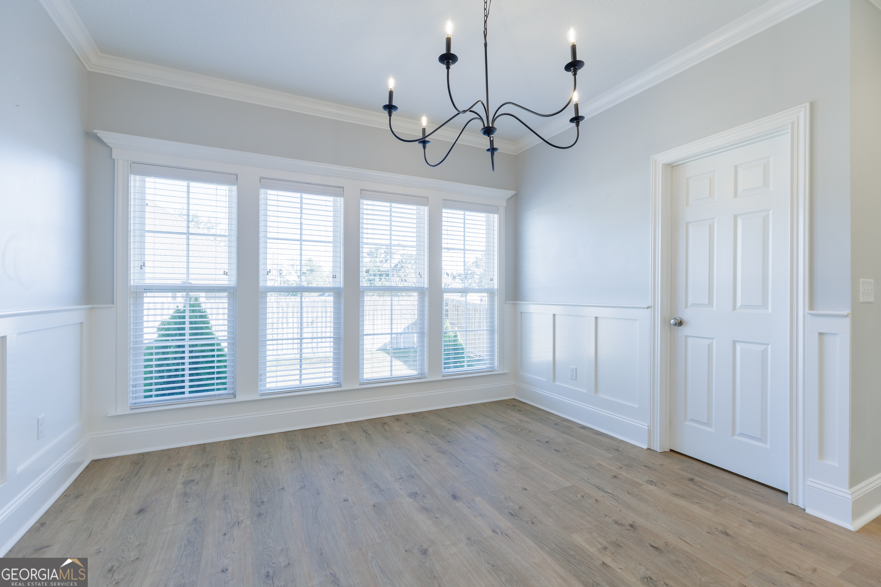 3001 Houser Way Hahira, GA 31632 - Photo 17 of 57 a view of an empty room with wooden floor and fan