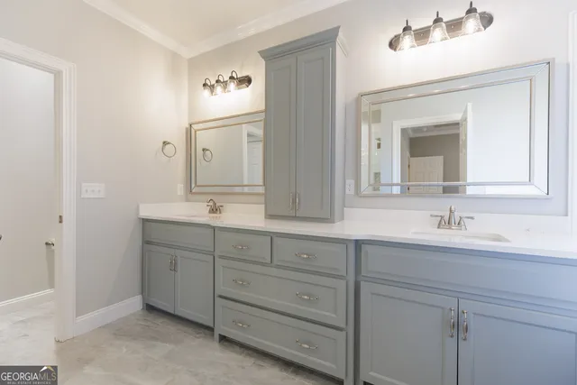 a bathroom with double sink and a bathtub