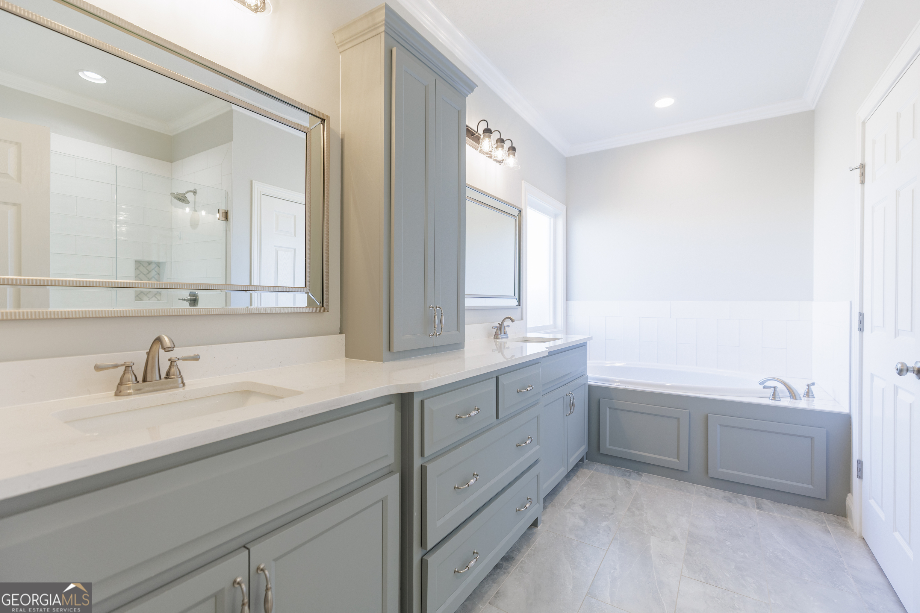 3001 Houser Way Hahira, GA 31632 - Photo 21 of 57 a bathroom with double sink and a bathtub