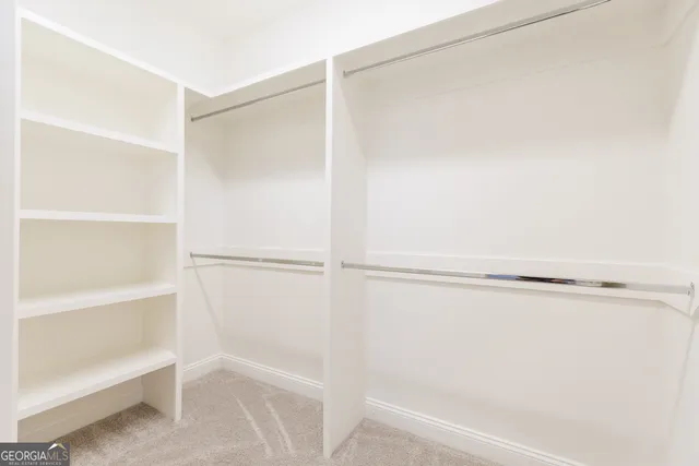 an empty room with a empty space and a window