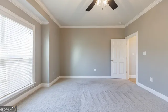 a view of an empty room and window