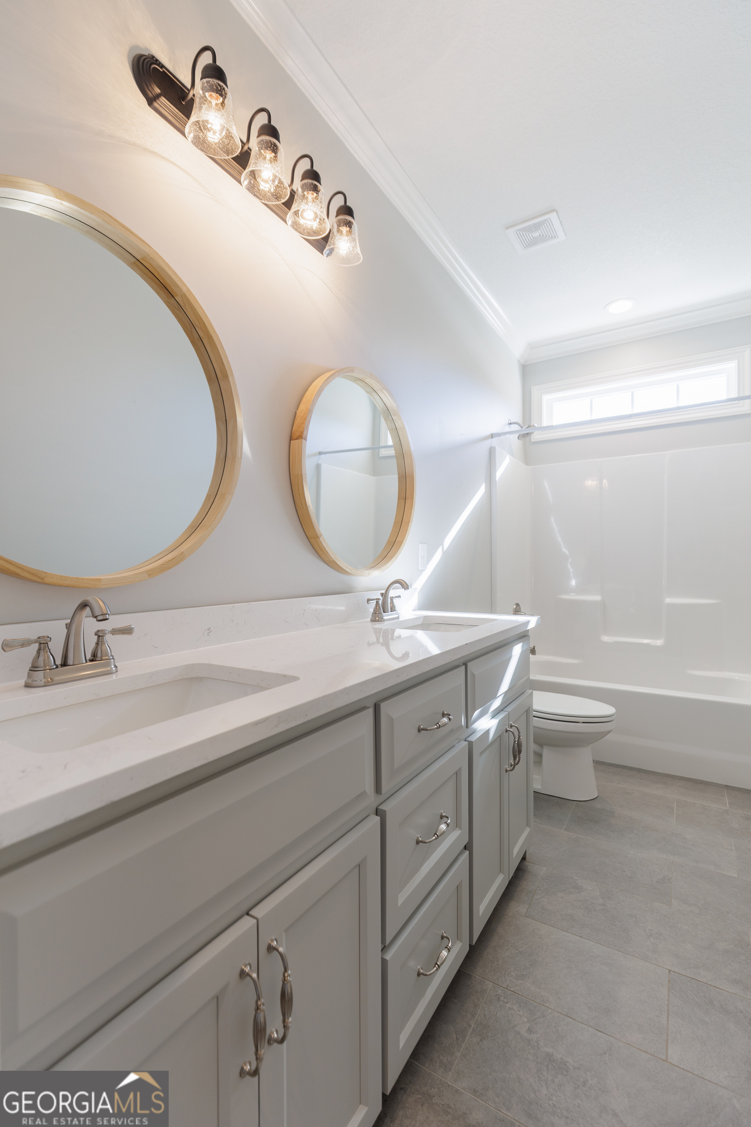 3001 Houser Way Hahira, GA 31632 - Photo 32 of 57 a bathroom with a double vanity sink and a mirror