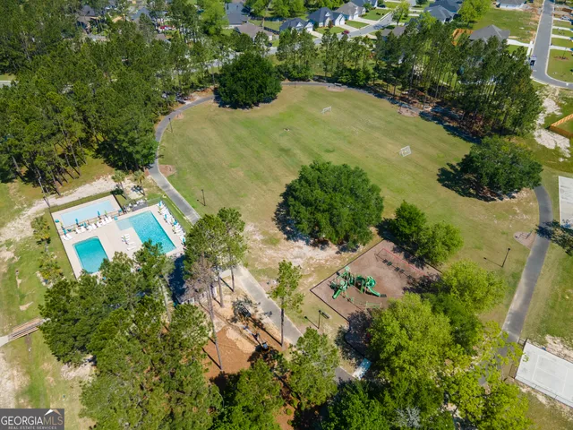a view of a swimming pool with an outdoor space and seating area