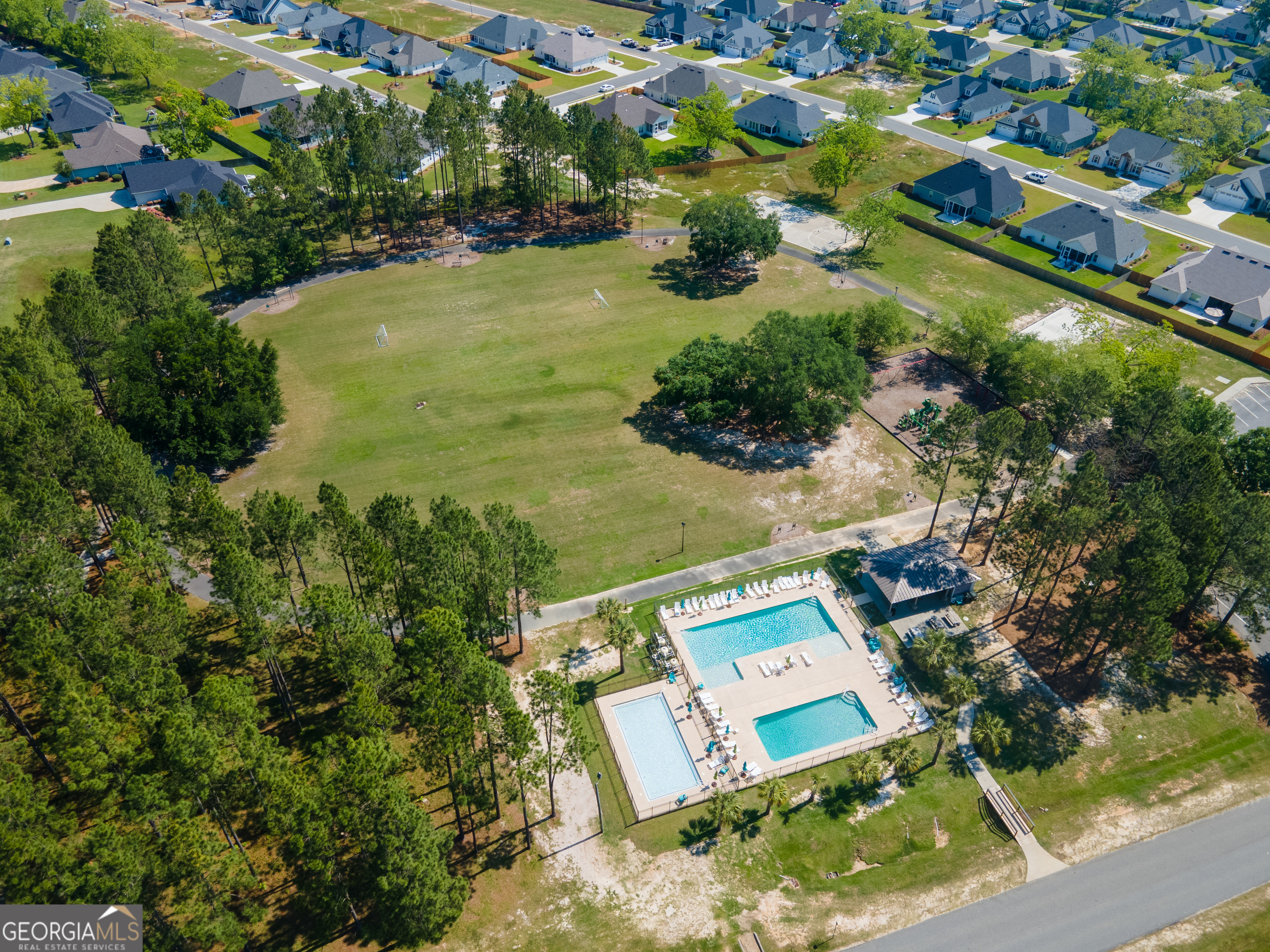 3001 Houser Way Hahira, GA 31632 - Photo 50 of 57 an aerial view of residential houses with outdoor space and swimming pool