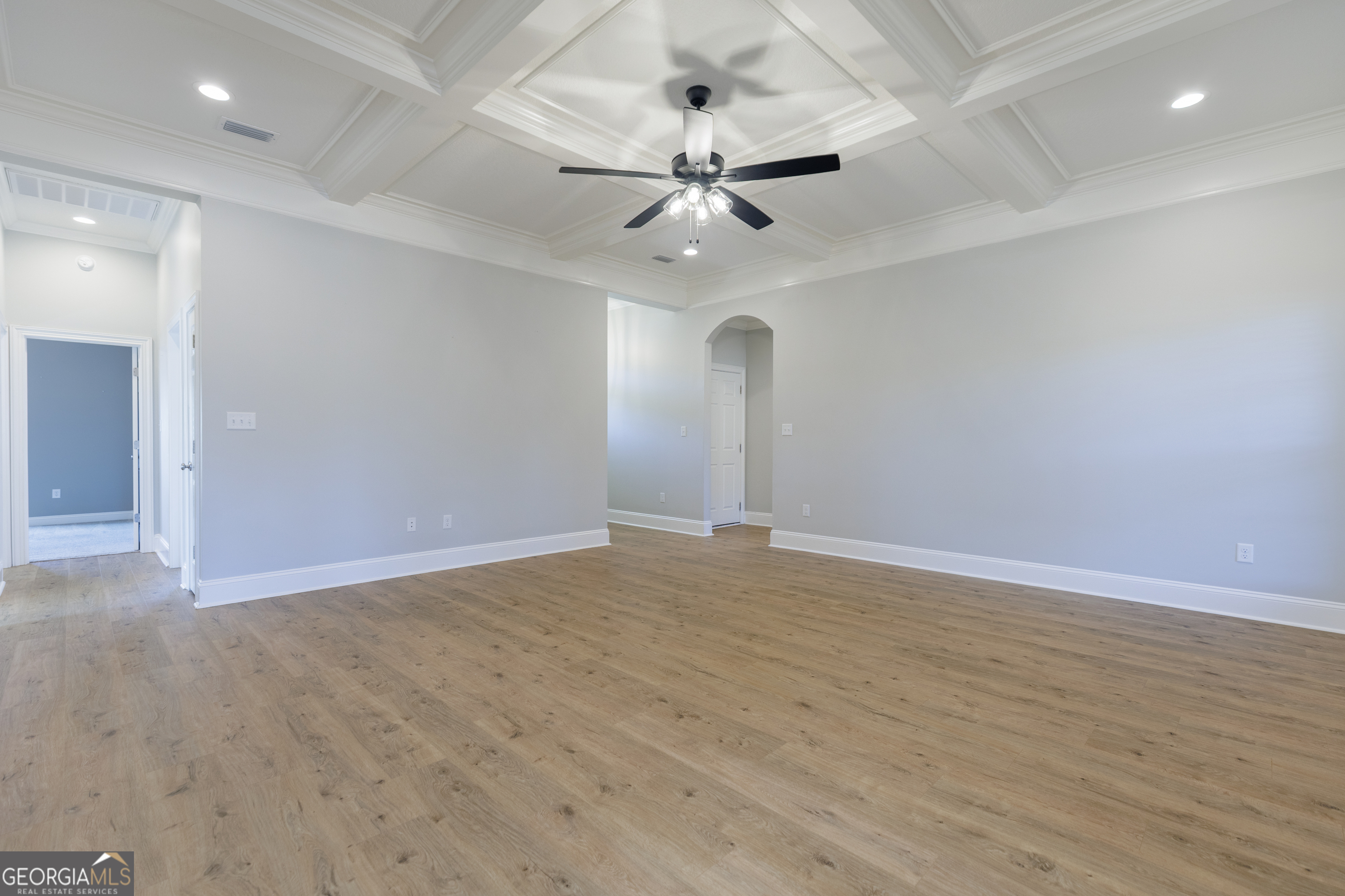 3001 Houser Way Hahira, GA 31632 - Photo 5 of 57 an empty room with wooden floor and ceiling fan