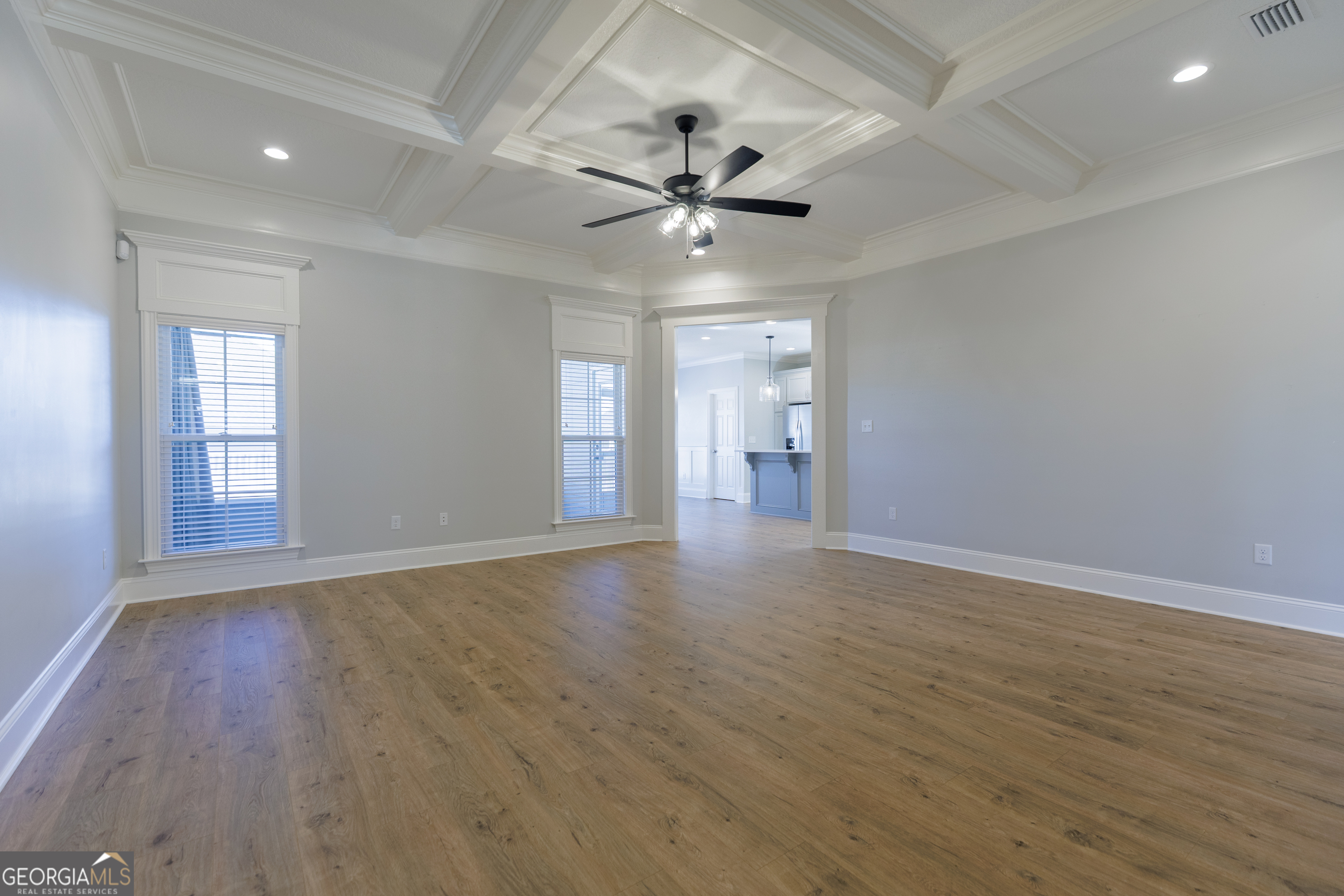 3001 Houser Way Hahira, GA 31632 - Photo 7 of 57 a view of an empty room with window and wooden floor